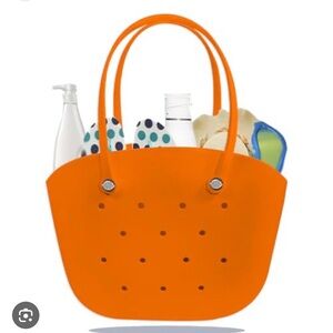 Orange Rubber Waterproof Tote Bag by Lemonking. 11” tall and about 15” wide.